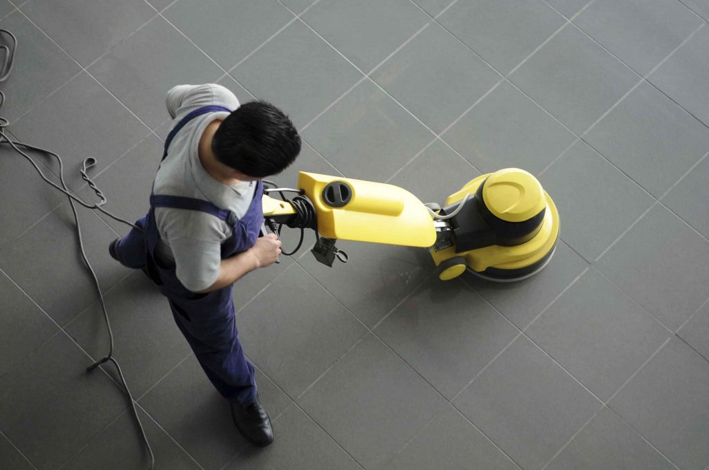 professional tile cleaner cleaning Black tiles by using a tile cleaning machine